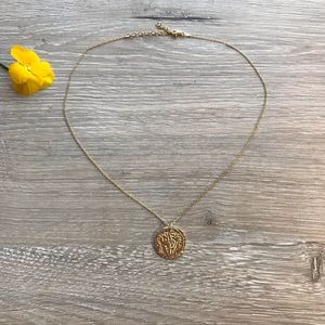 Gold medallion necklace